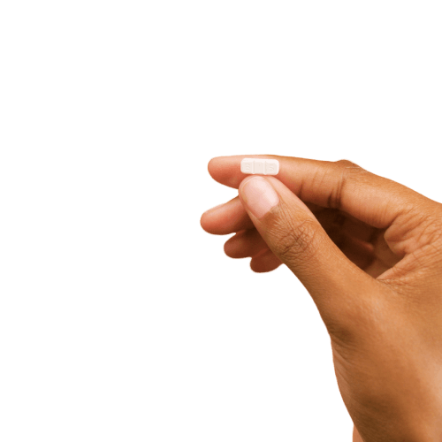 Hand holding pill