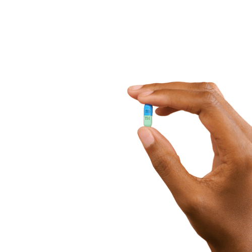 Hand holding pill